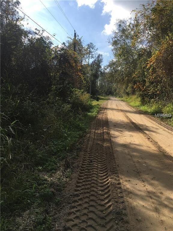 Dirt road going to the subject property