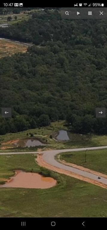 View of property's community with a forest view