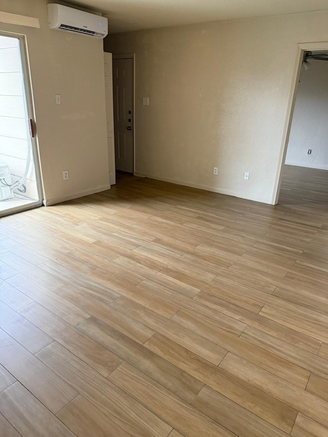 Spacious living room with neutral tones and natura