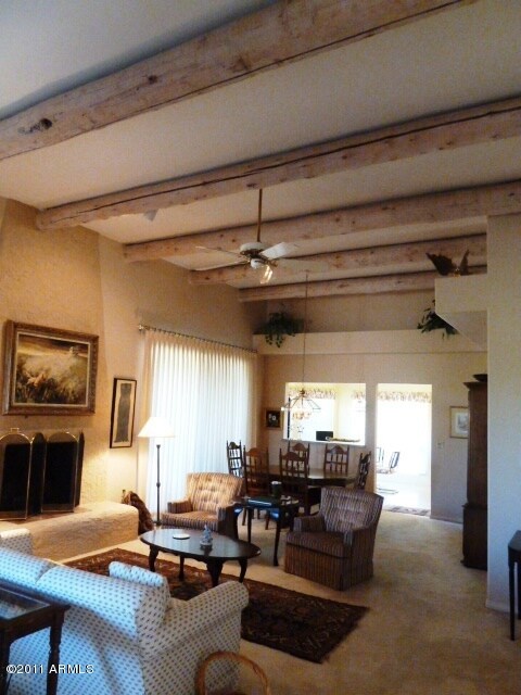 Living Room With Large Wood Beams