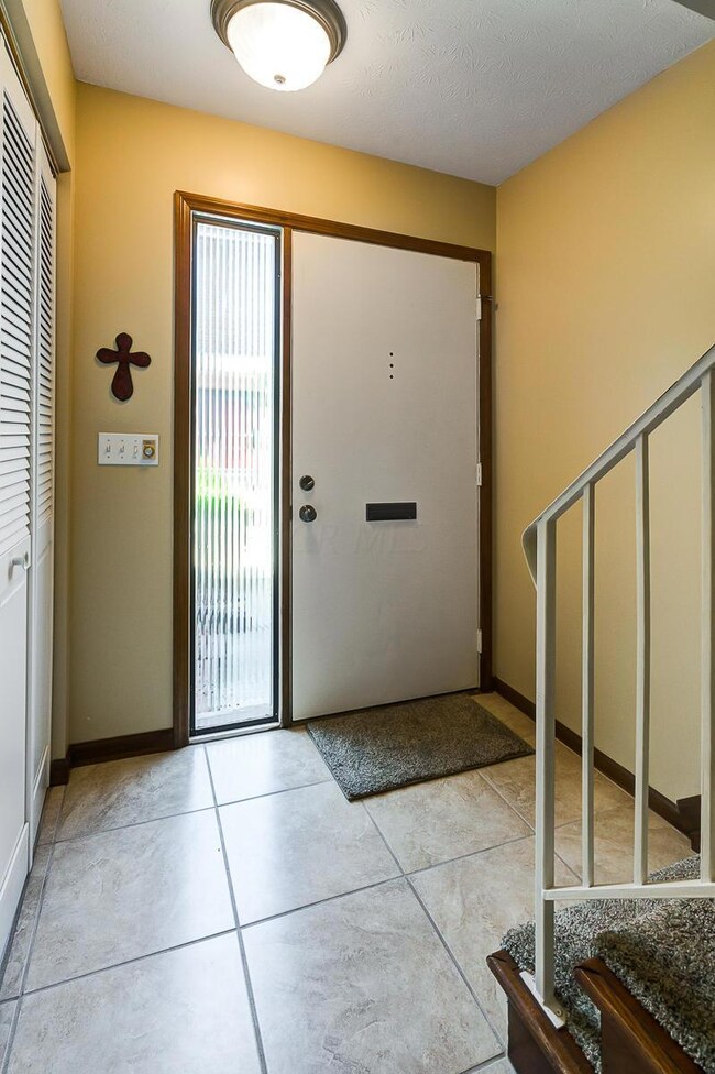 Tile Floor Enrty With Closet