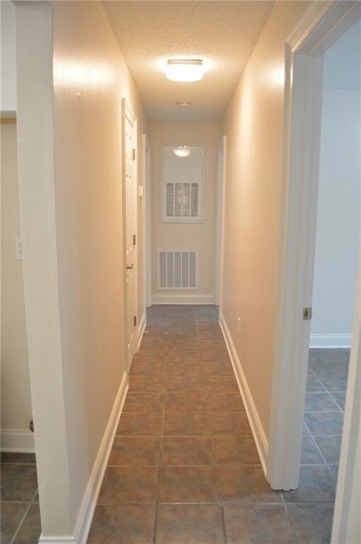 Hall way....Tile throughout the condo