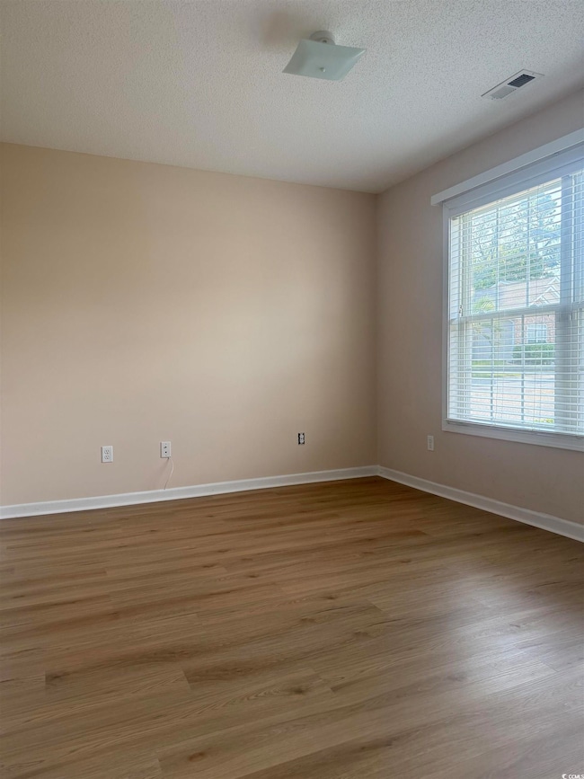 This is a split bedroom floor plan, the first bedroom is to the right of the living room.  This can be used as a bedroom or a study.
