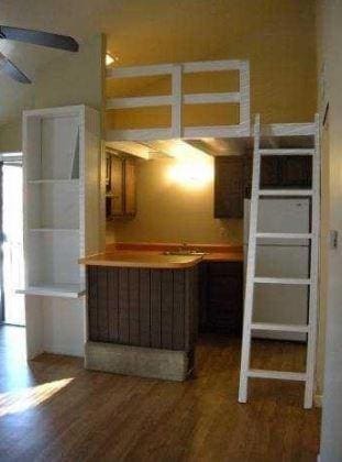 Kitchen with wood finished floors and a ceiling f