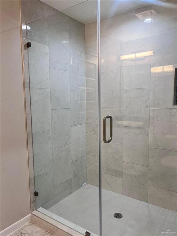 Bathroom featuring walk in shower
