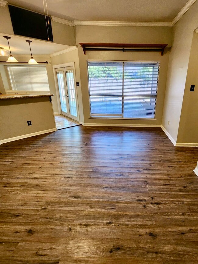 Large windows and French doors in the Living Room and Kitchen provide lots of natural light.