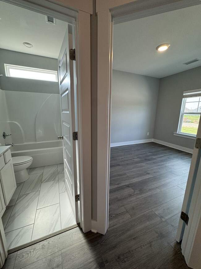 4th bedroom and Full Bath #2  *Photo is from a previous listing displaying the completed floor plan some options and selections may vary from actual home.