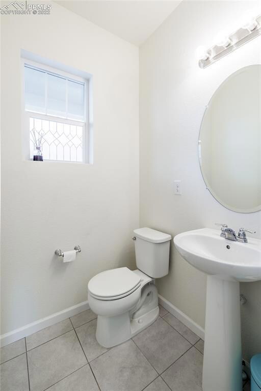 First floor half bath near front door.
