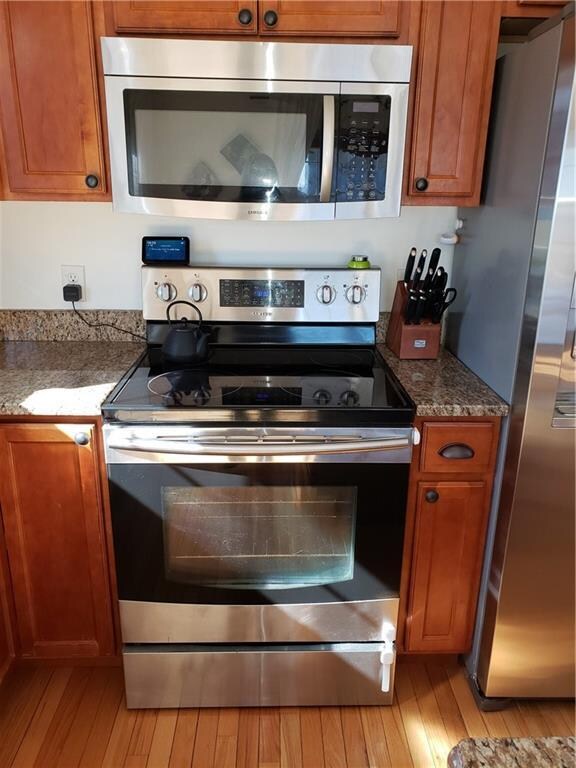 Stainless steel appliances include microwave vent