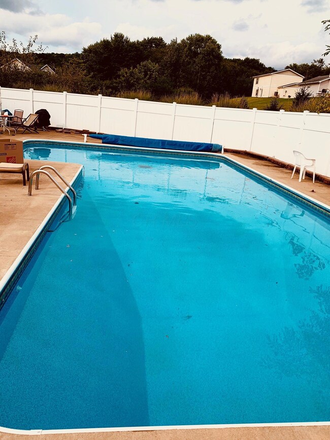 Privacy fence around this awesome in-ground pool.