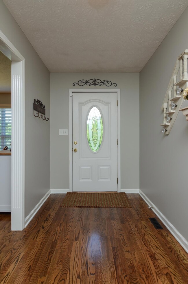 Welcome friends and family to your new home through open entry hall.