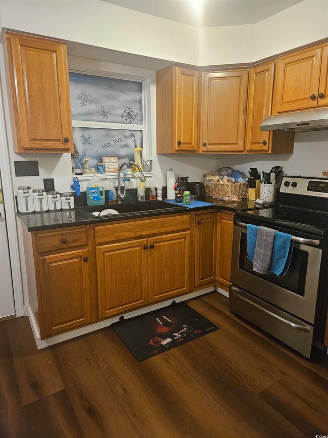 Kitchen featuring dark hardwood / wood-style floor