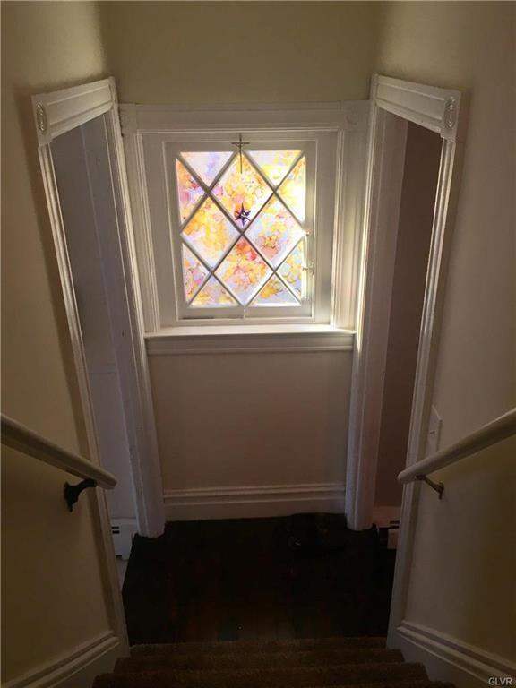Multi Paned window at bottom of staircase.