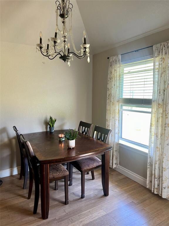Dining room with an inviting chandelier, a healthy