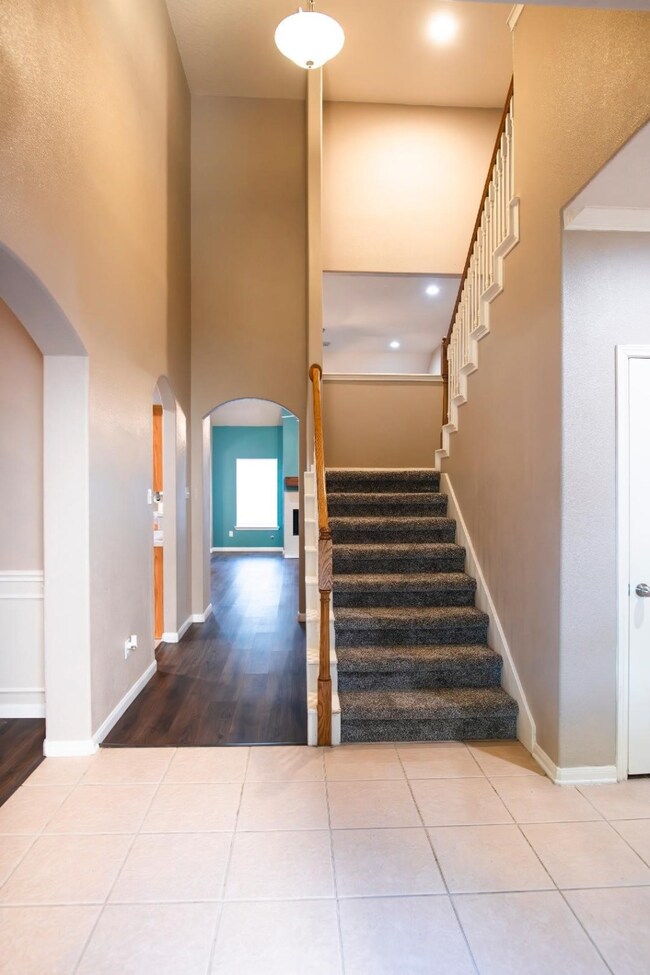 Grand two-story entrance greets you as you enter t