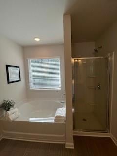 Bathroom with a shower stall, a garden tub, and wo