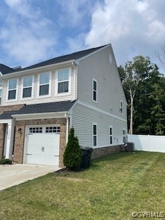 View of home's exterior featuring a garage, concre