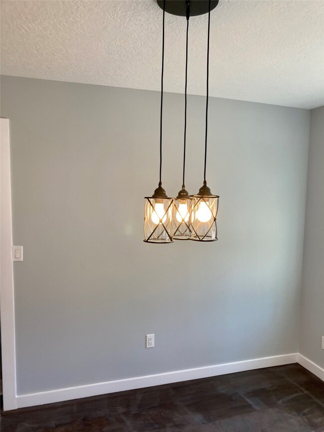 New wood floors and new light fixtures throughout.