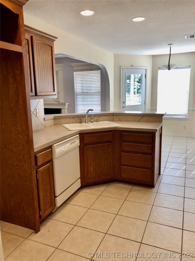 Kitchen as seen from the hall to the master bedroo