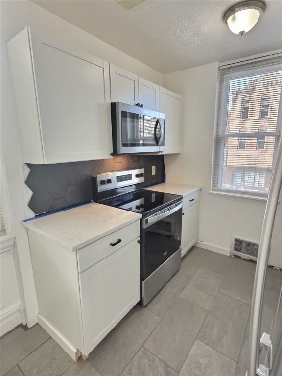 Brand new electric stove and microwave.