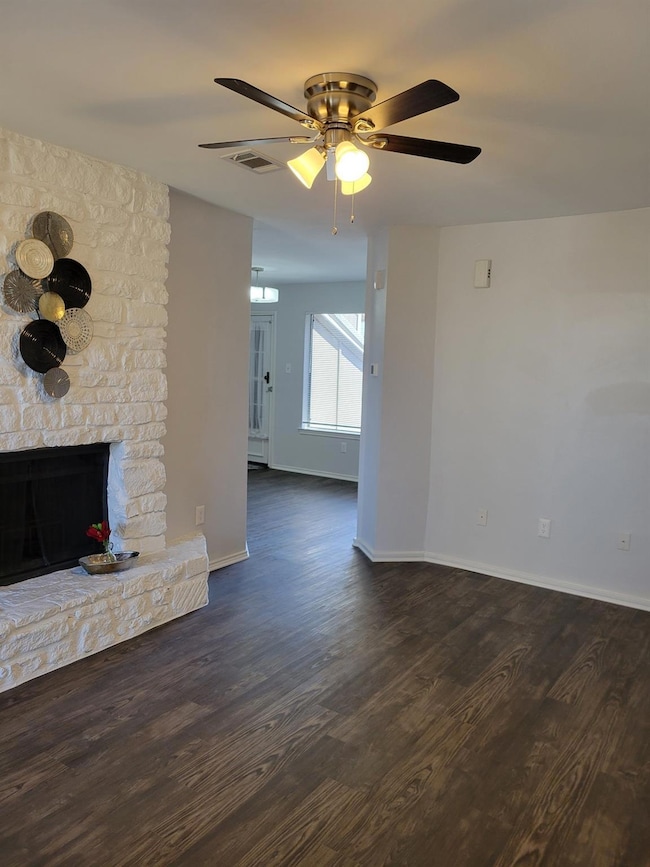 Unfurnished living room with visible vents, wood 