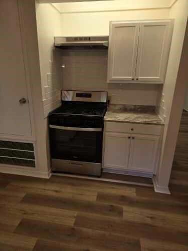 Kitchen features a new stainless steel stove and v