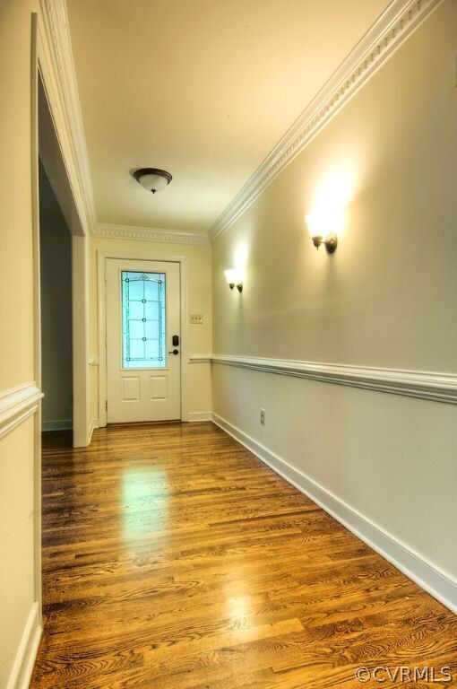 Light and bright foyer with hardwood floors and to