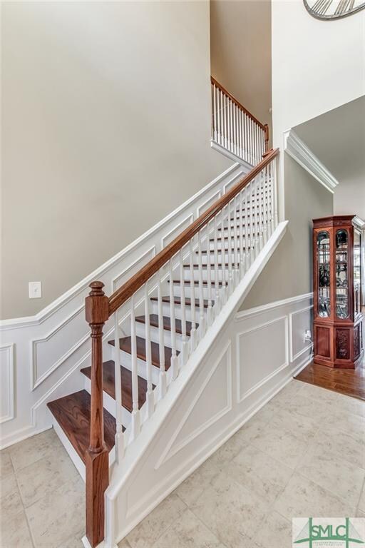 Wood stair treads with spindle railing and overloo