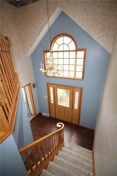 Two story foyer with faux finish painting. Newer w