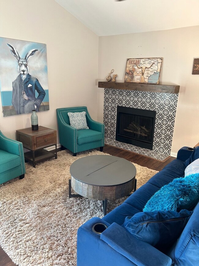 Living room with wood-burning fireplace