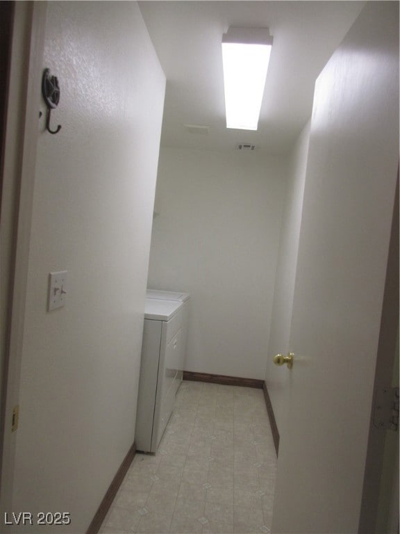 Laundry area featuring washer and dryer and light