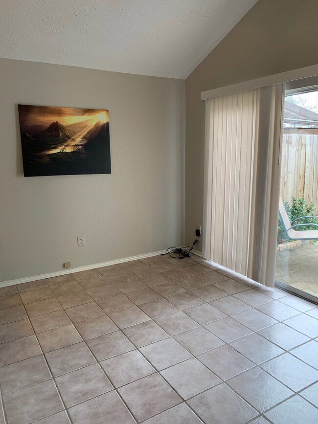 Tiled breakfast area with nice view to the backyard and patio area.  Lots of natural light!