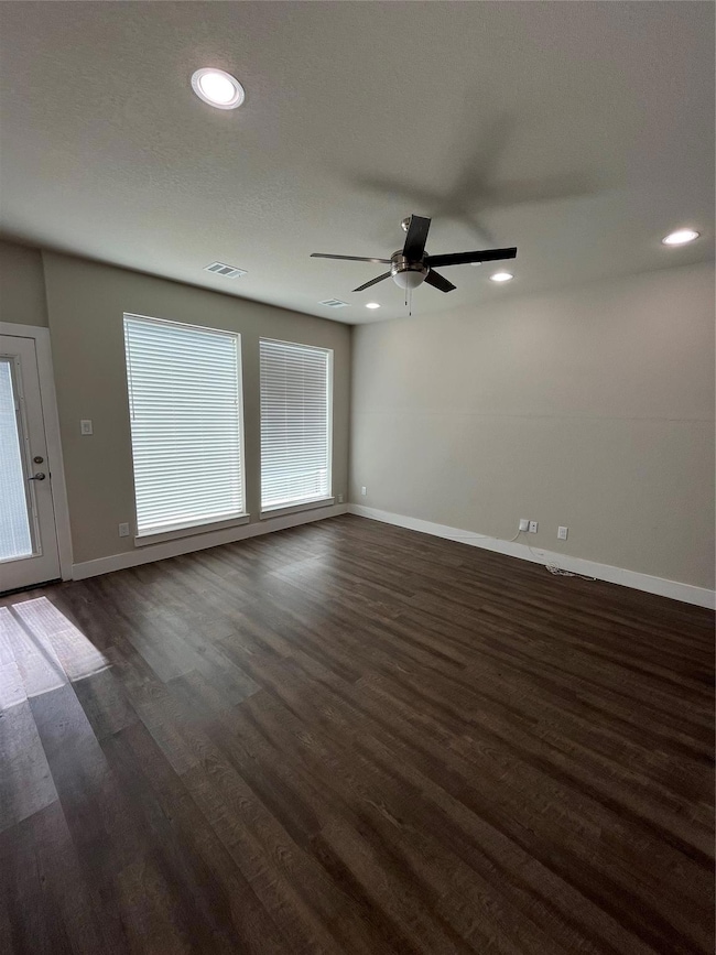 Spare room with recessed lighting, a ceiling fan, 