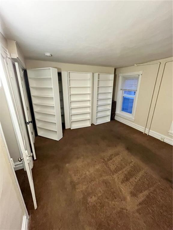 Front bedroom with ample closet and unique shelf a