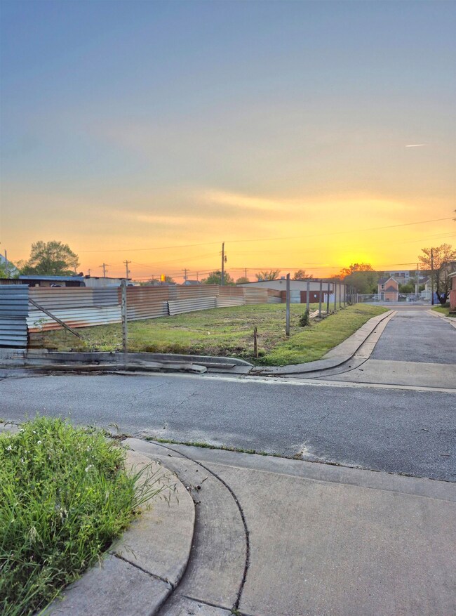 View of road featuring curbs and sidewalks
