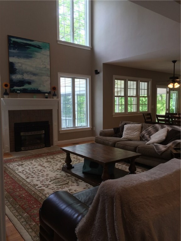 Living room flows to the dining area and kitchen.