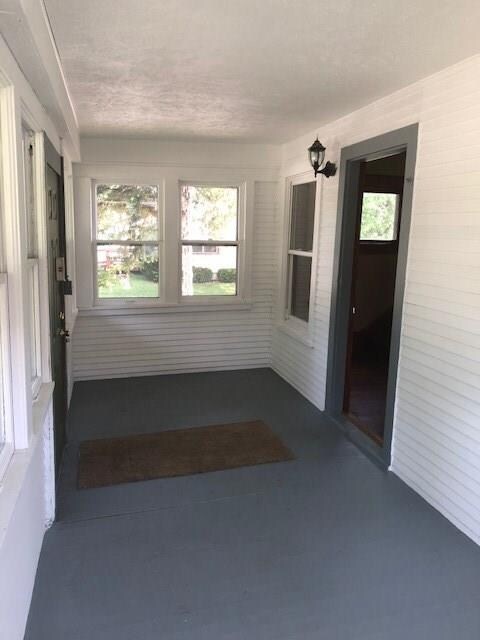 Front porch with window surround.