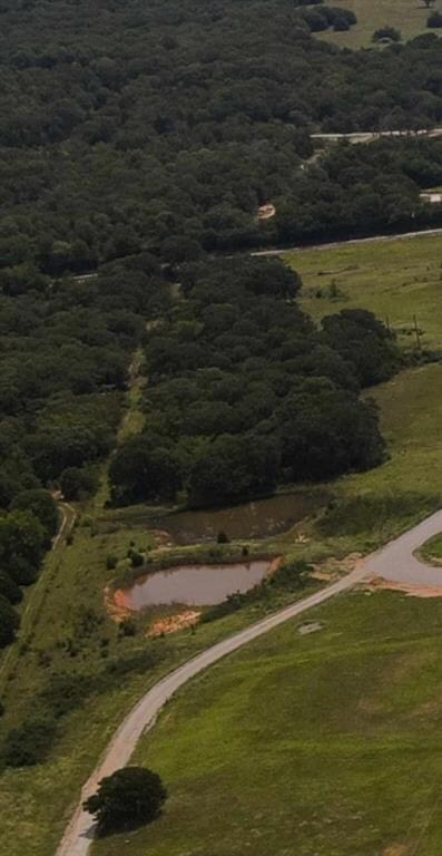 Aerial overview of property's location with a forest