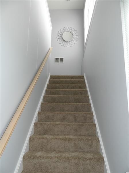Bright Entry up stairs with brand new carpet
