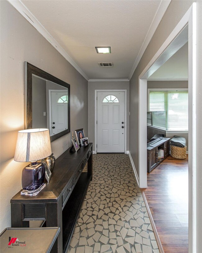 Entrance foyer featuring dark hardwood / wood-styl