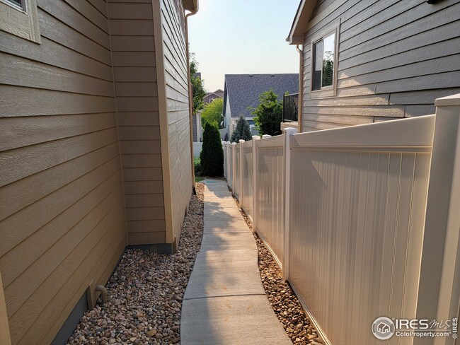 North side of home. Cement path for lawn mower