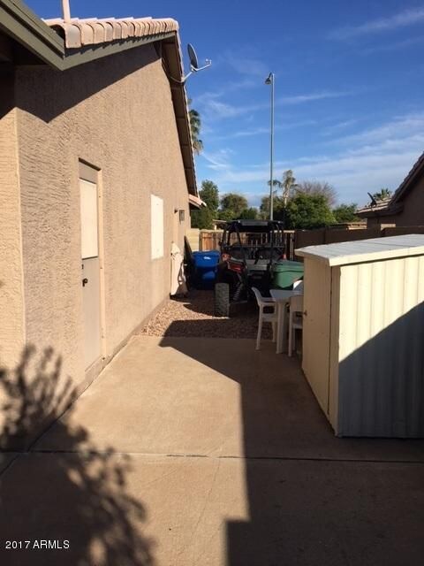 Side yard with RV Gate and Shed