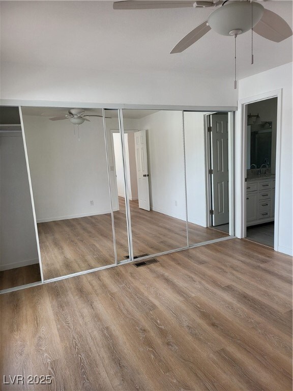 Unfurnished bedroom with connected bathroom, visib