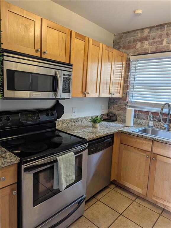 Kitchen with appliances with stainless steel finis