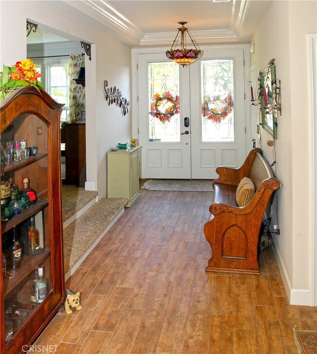 Foyer with Double Door Entry and Hardwood flooring.