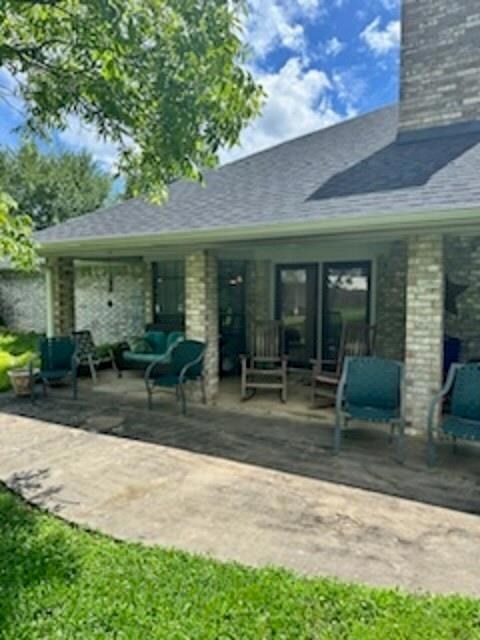 Rear view of property with a patio
