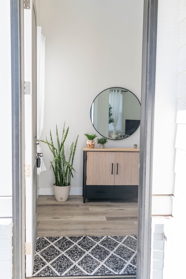 Bathroom featuring vanity and wood finished floors