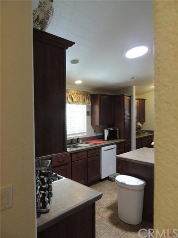 Tubular skylight brightens the kitchen.