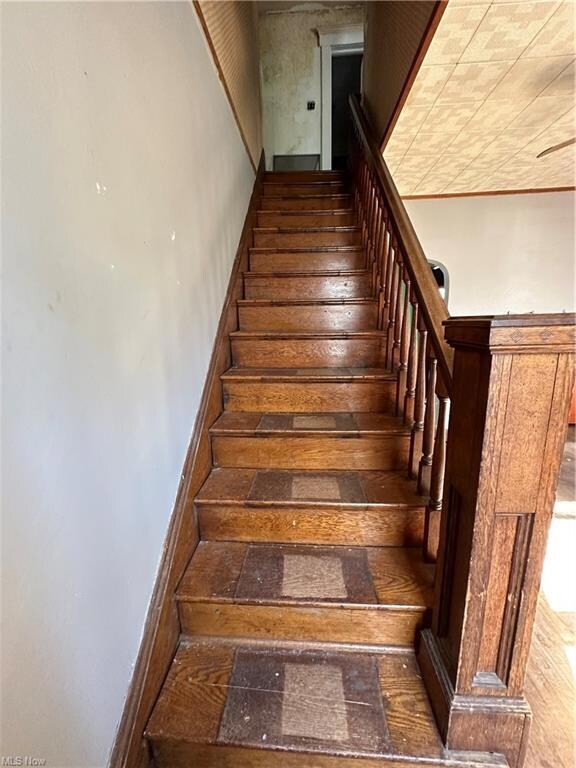 Stairs with dark hardwood floors