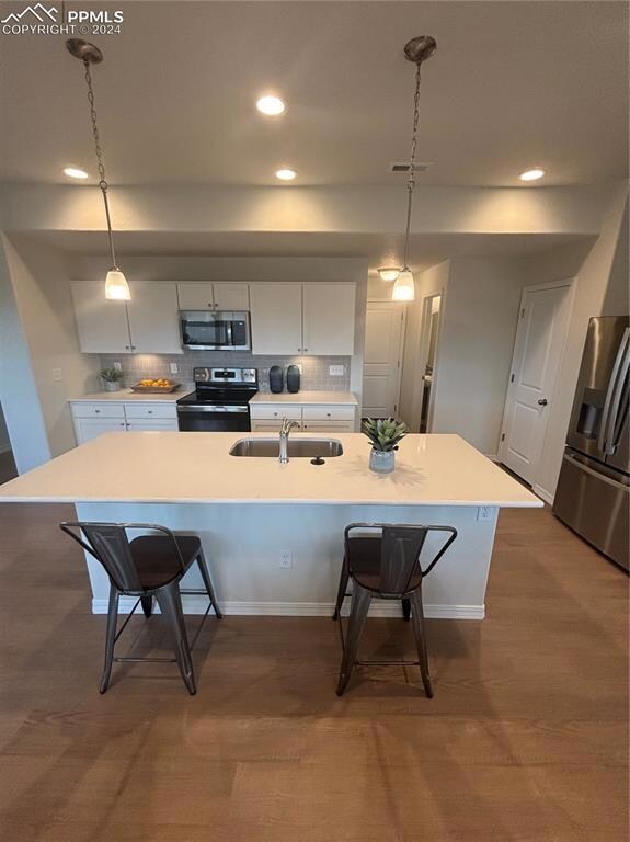 Kitchen with pendant lighting, range, decorative b